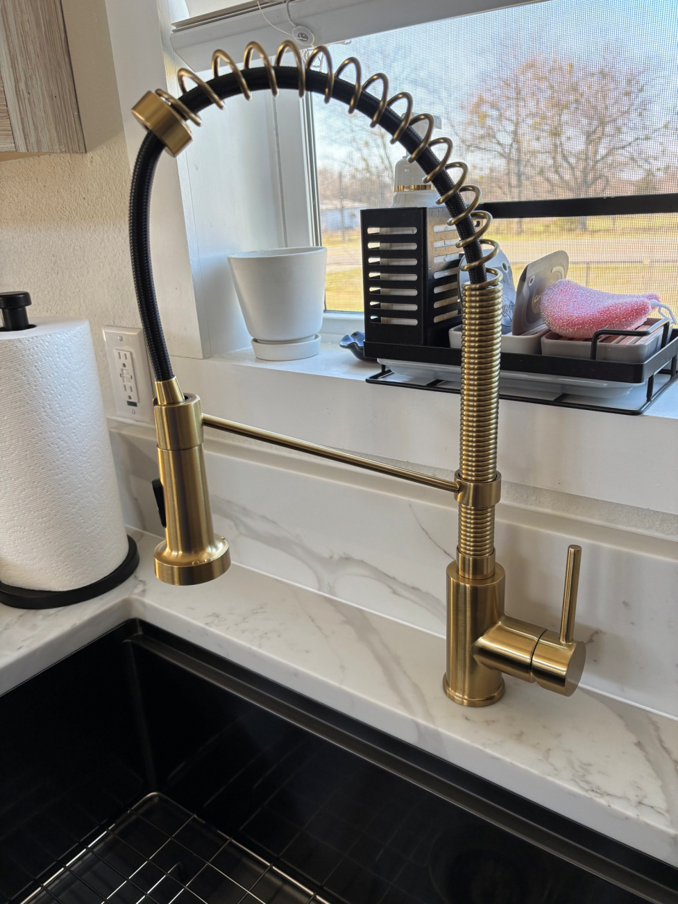 A sleek modern kitchen faucet.