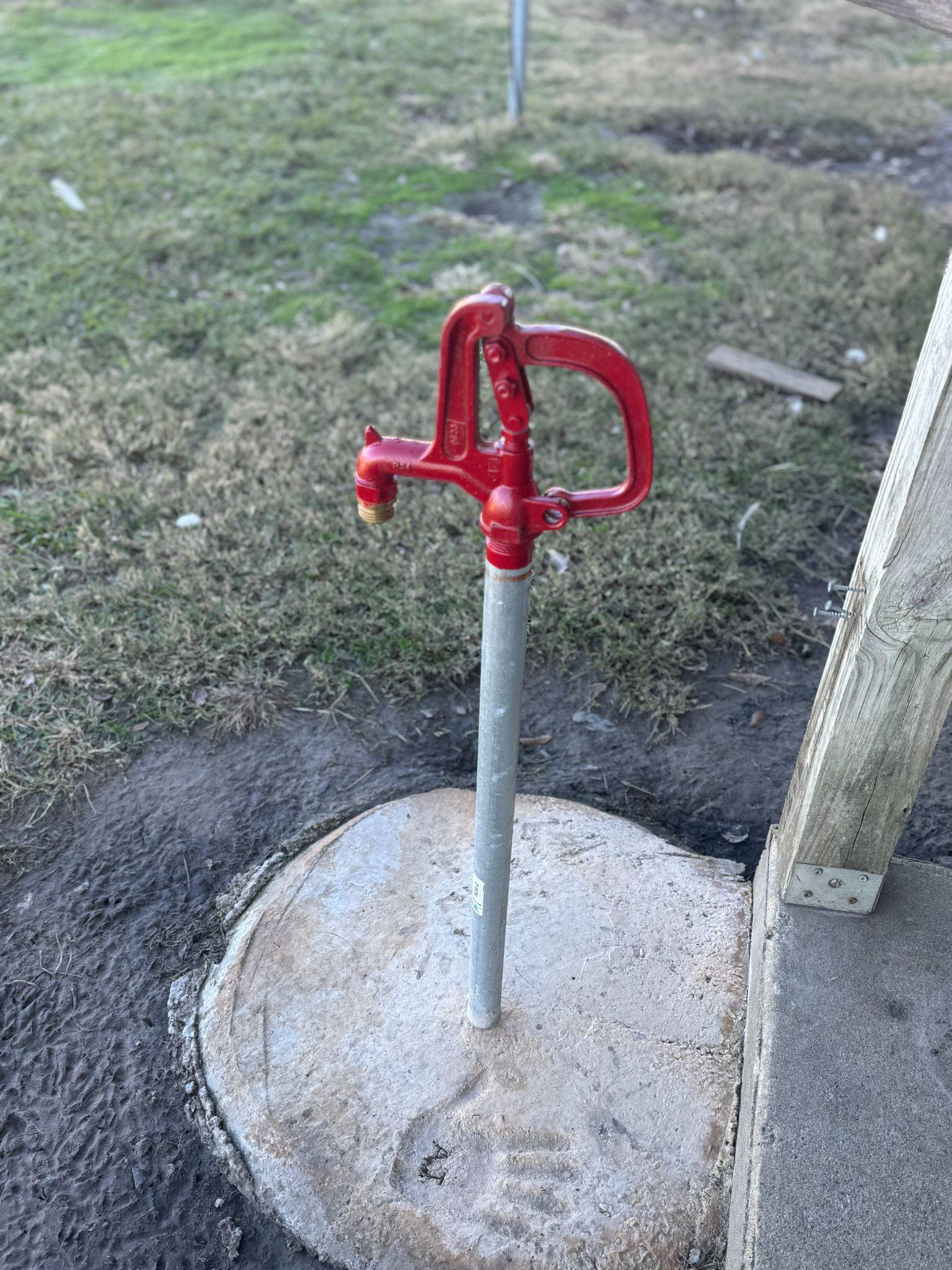 A yard hydrant installed outdoors.