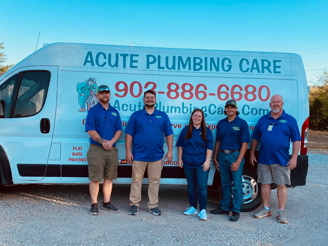 The Acute Plumbing Care team standing proudly in front of their service van in Greenville, TX